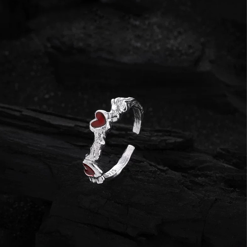 Close-up of the Cupid's Heart Ring in silver, emphasizing the fine craftsmanship and shimmering surface of the heart motif.