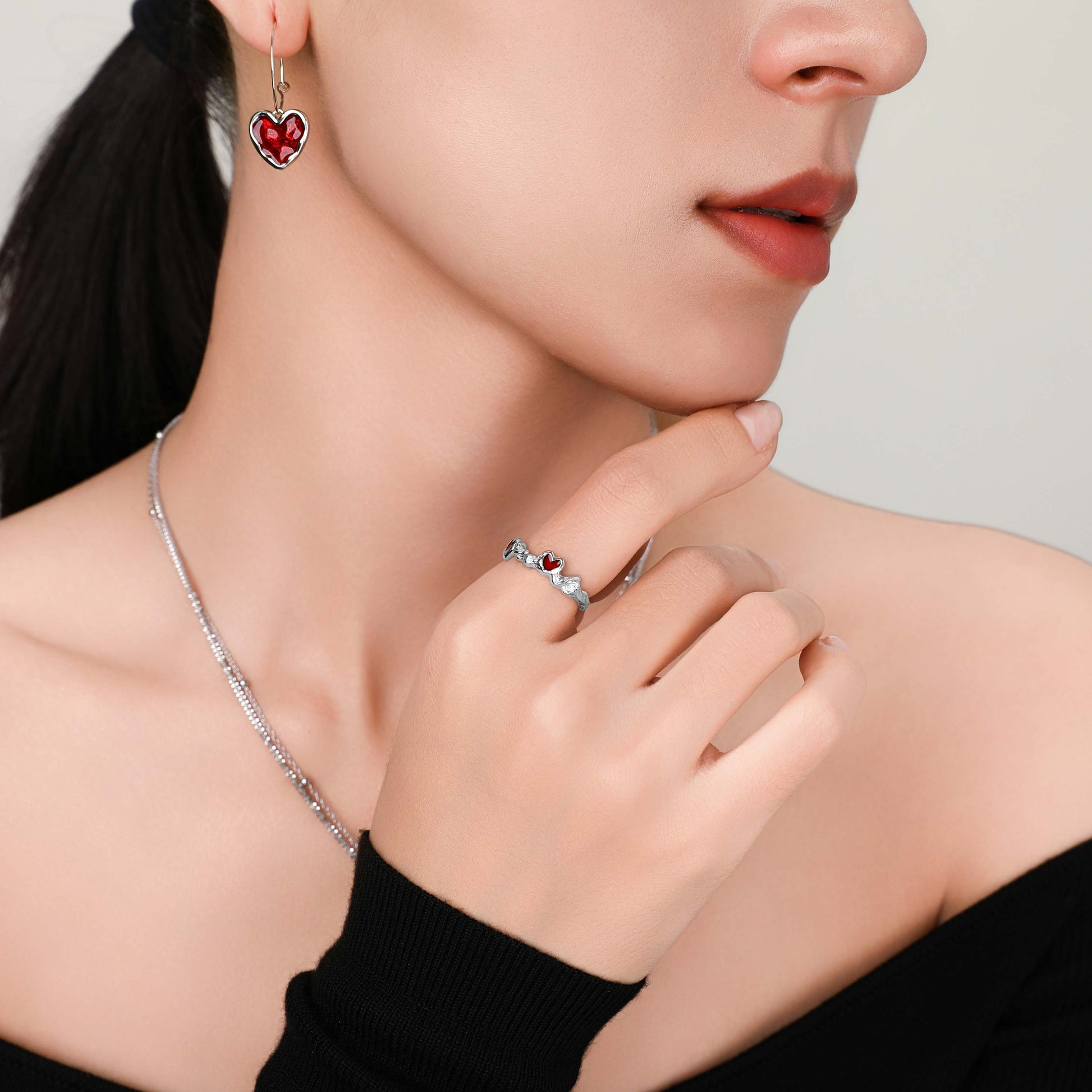 Model wearing the Cupid's Heart Ring in silver, showcasing how the ring fits gracefully on the finger with a stylish and timeless look.