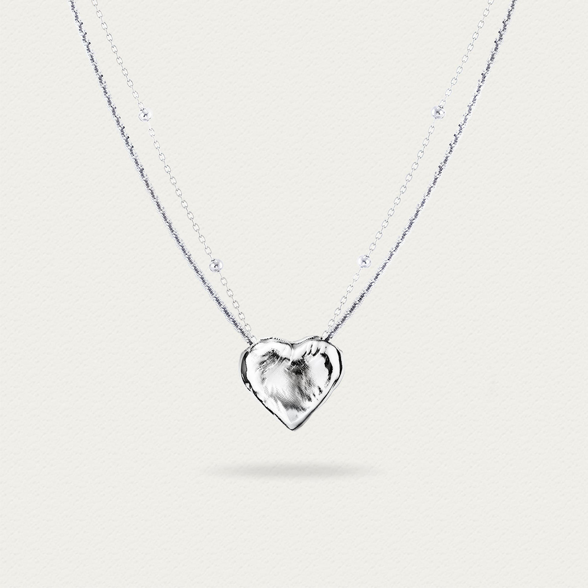 Front view of the Little White Peach Necklace, showcasing the delicate white peach-shaped pendant and its elegant chain design.