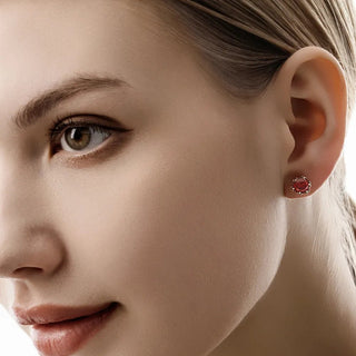 Model wearing the red Baroque Bloom Moissanite Earrings, demonstrating the bold pop of color and vintage charm on the earlobe.