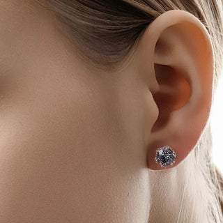 Model wearing the silver Baroque Bloom Moissanite Earrings, showing how the elegant floral design complements a classic style.