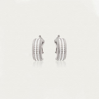 Front view of the D.POW baroque-inspired zircon hoop earrings, showcasing intricate metalwork and brilliant sparkle.