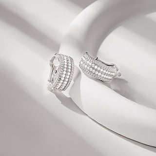 Side angle of the sparkling 925 silver zircon hoop earrings, highlighting the curved silhouette and faceted zircon placement.