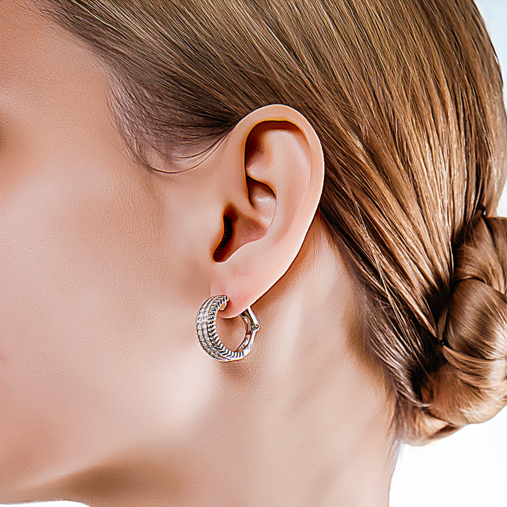 Model wearing the D.POW zircon hoop earrings, showing how they frame the face with vintage-inspired elegance.