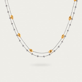 Front view of the Frozen Echo Brushed Nut Shell Double Layer Necklace, showcasing the intricate texture of the nut shell pendant and layered design.