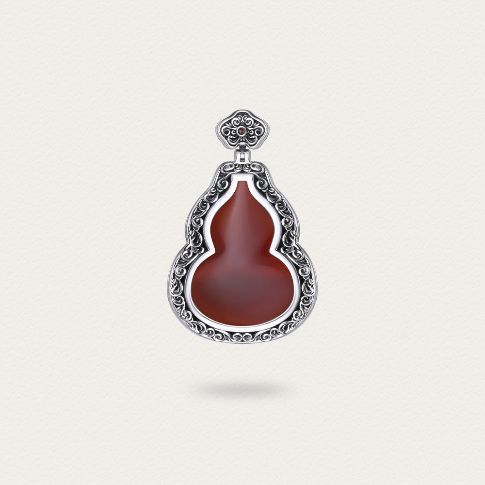 Front view of the D-POW cinnabar gourd pendant in sterling silver, showcasing its rich red hue and detailed texture.