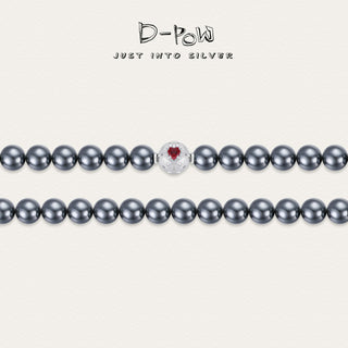 Close-up detail of the D-POW Cosmic Amour peach motif necklace, highlighting the delicate peach-shaped motif and high-quality 925 sterling silver.