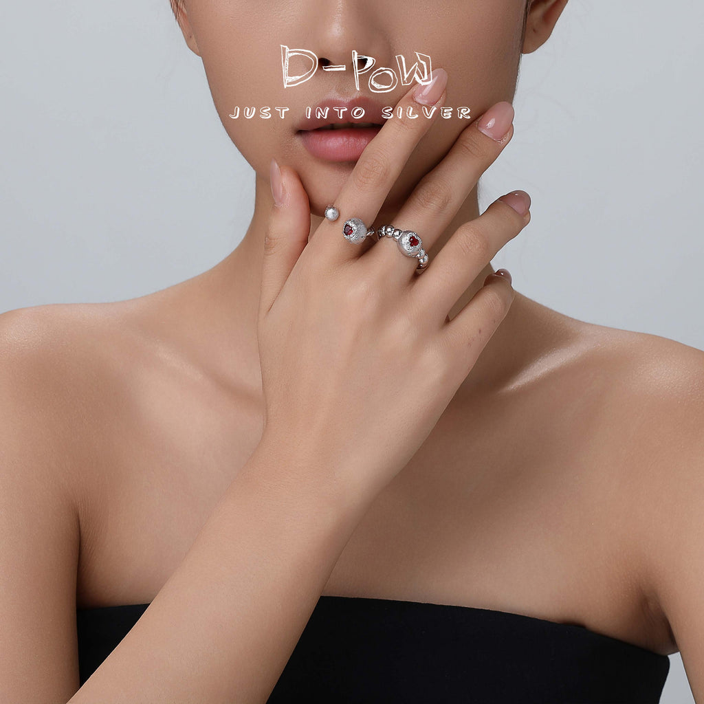 Angled view of the D-POW Cosmic Amour 925 silver adjustable ring worn, highlighting the adjustable fit and celestial peach design.