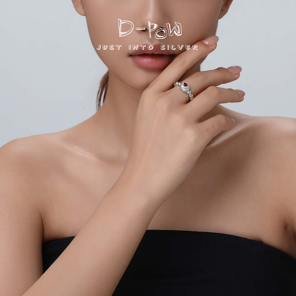 Side view of the D-POW Cosmic Amour 925 silver adjustable ring worn, showcasing its delicate design and celestial peach-inspired detail.