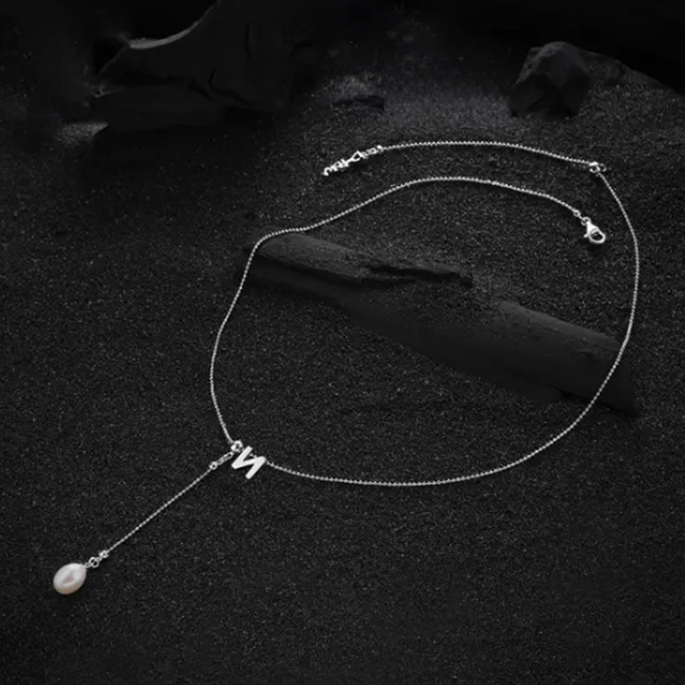 Cream-colored letter "N" pendant, designed with a minimalist yet elegant touch.