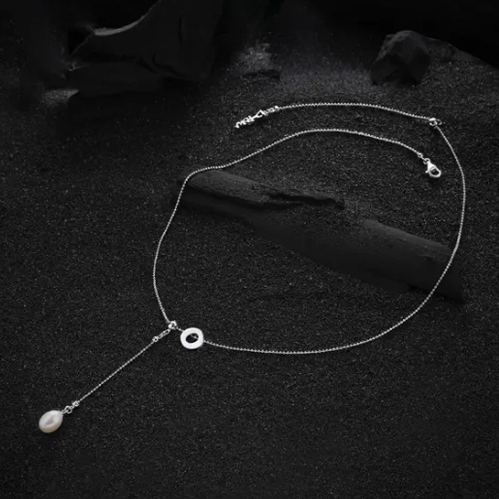 The "O" letter pendant, displayed with a clean and simple design, emphasizing its polished finish.
