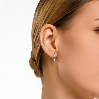 Model wearing the silver crushed ice textured hoop earrings, demonstrating their radiant shimmer and everyday elegance.
