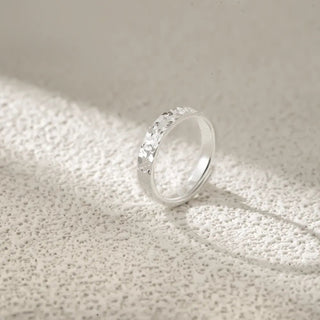 Side angle view of the Crushed Ice Statement Ring in sterling silver, highlighting the adjustable band and distinct crushed ice pattern.