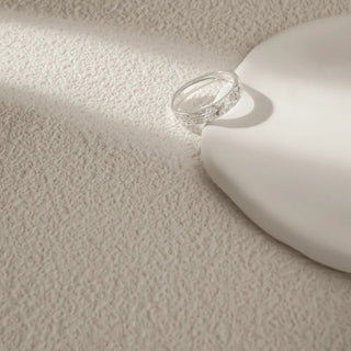 Close-up of the Crushed Ice Statement Ring in sterling silver, emphasizing the intricate texture and polished finish of the band.