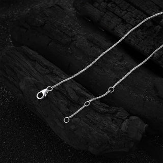 Detailed shot of the sterling silver chain and clasp of the Cupid's Heart Necklace.