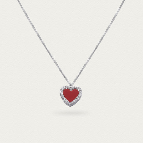 Close-up of the front of the red agate heart pendant, showing the rich color and smooth polished surface.