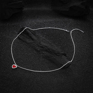 Full view of the Cupid's Heart Agate Necklace, featuring a vibrant red heart-shaped agate pendant on a sterling silver chain.