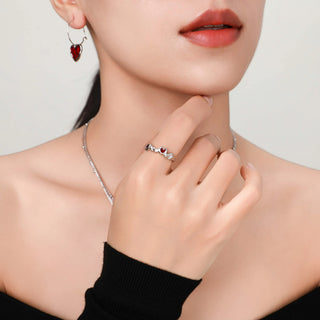 Another view of the model wearing the Cupid's Heart Ring in silver, highlighting the heart design as it catches the light.