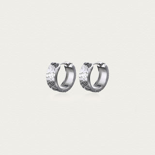 D-POW hammered sterling silver ear cuffs in M size, with a classic hammered finish, providing a stylish and modern look in a close-up view.
