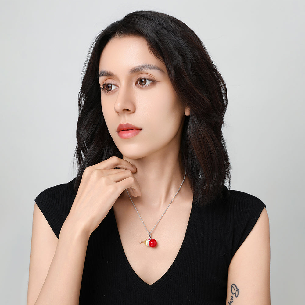 Lifestyle shot of the Festive Lucky Gourd necklace on a model, featuring the pendant’s gleam against soft skin tones.