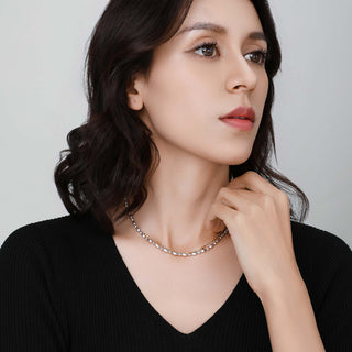 Lifestyle image of the silver Ice Crystal necklace on a model, styled for a refined, everyday luxury look.