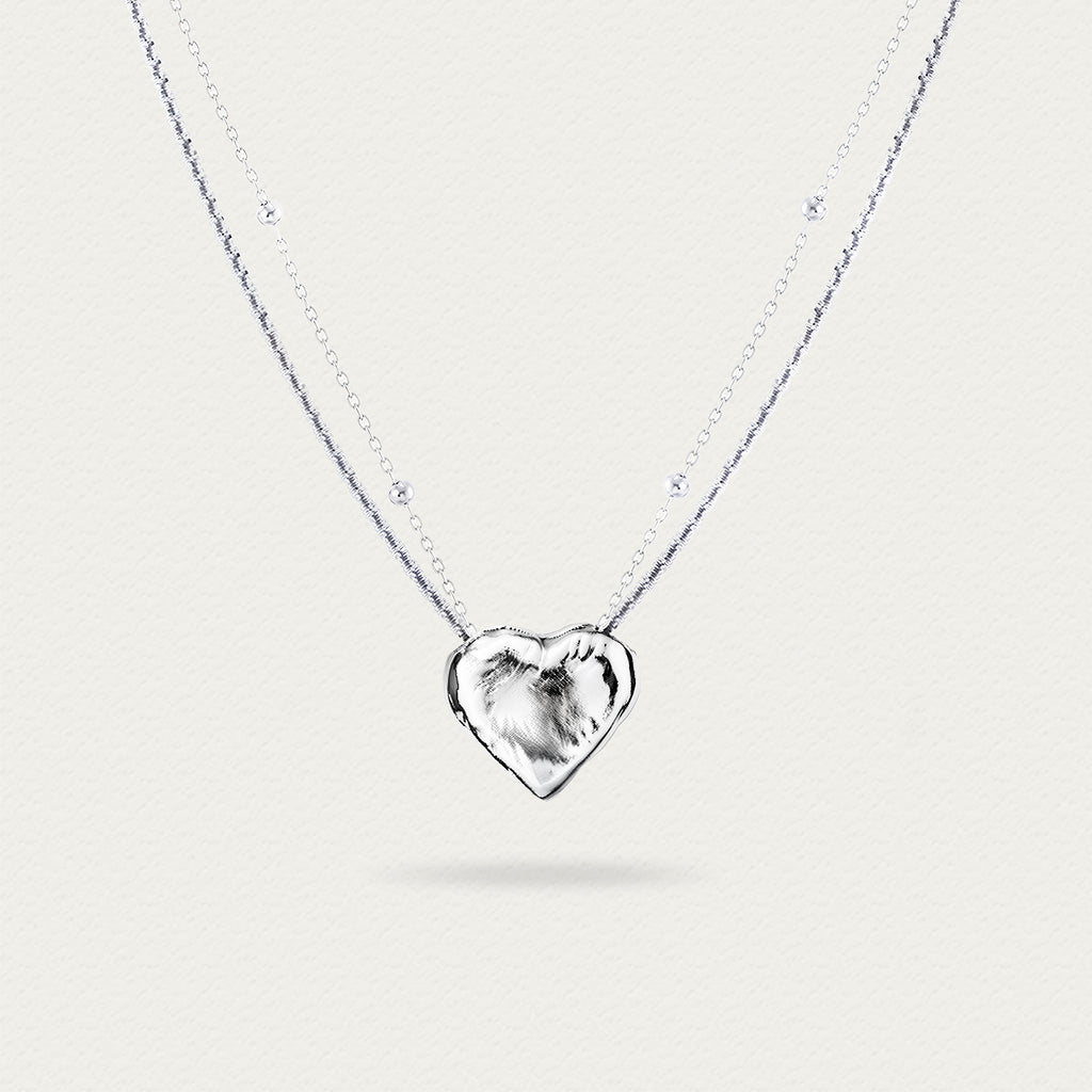 Front view of the Little White Peach Necklace, showcasing the delicate white peach-shaped pendant and its elegant chain design.