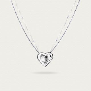 Front view of the Little White Peach Necklace, showcasing the delicate white peach-shaped pendant and its elegant chain design.