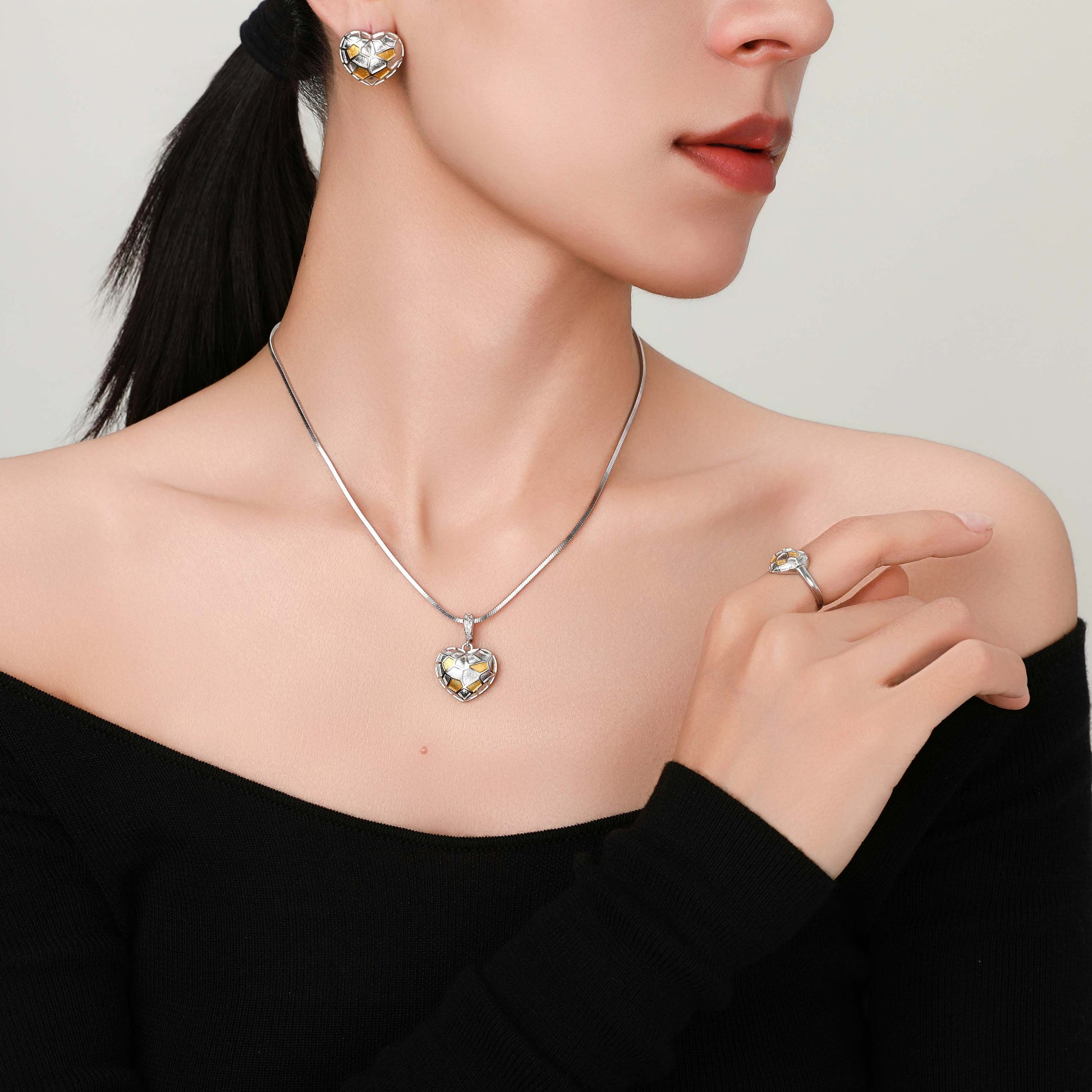 Model wearing the Princess Heart Ring, showing how it catches the light elegantly on the finger.