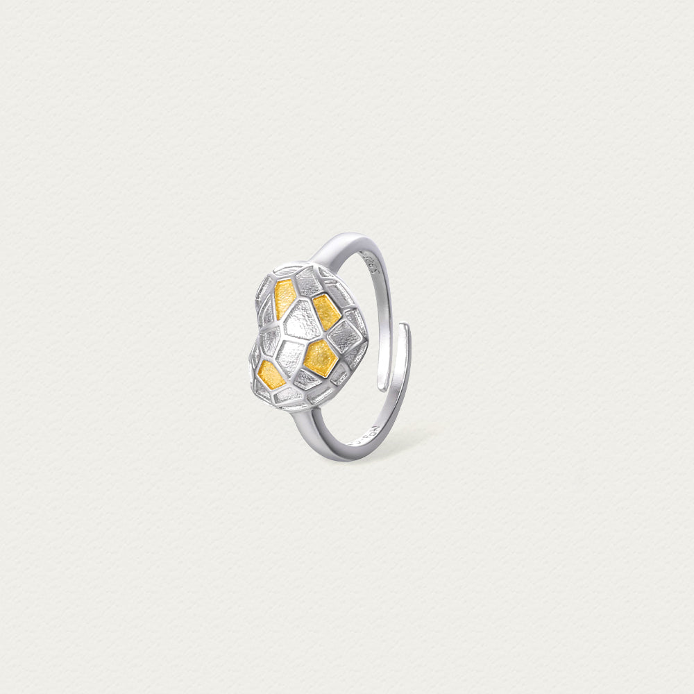 Side profile of the ring showcasing the depth of the heart-cut stone and smooth silver band.