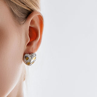 Model wearing the Princess Ice Cube Heart Treasure Stud Earrings, showing how the sparkling heart design sits delicately on the earlobe.