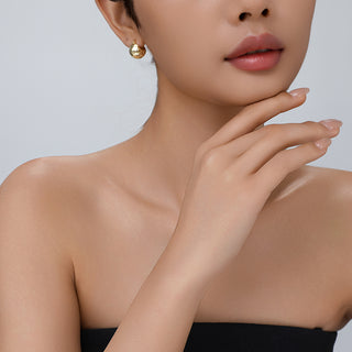 Close-up of model styling the Shattered Cosmos ear cuff, emphasizing its sculptural detail and refined edge.