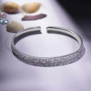 Side view of the Shatterlight Series Hammered 999.9 Fine Silver Adjustable Cuff, showing the sleek design and fine silver craftsmanship.