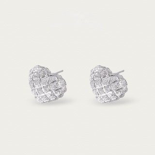 Side angle of the silver iced heart stud earrings, highlighting their three-dimensional form and polished setting.