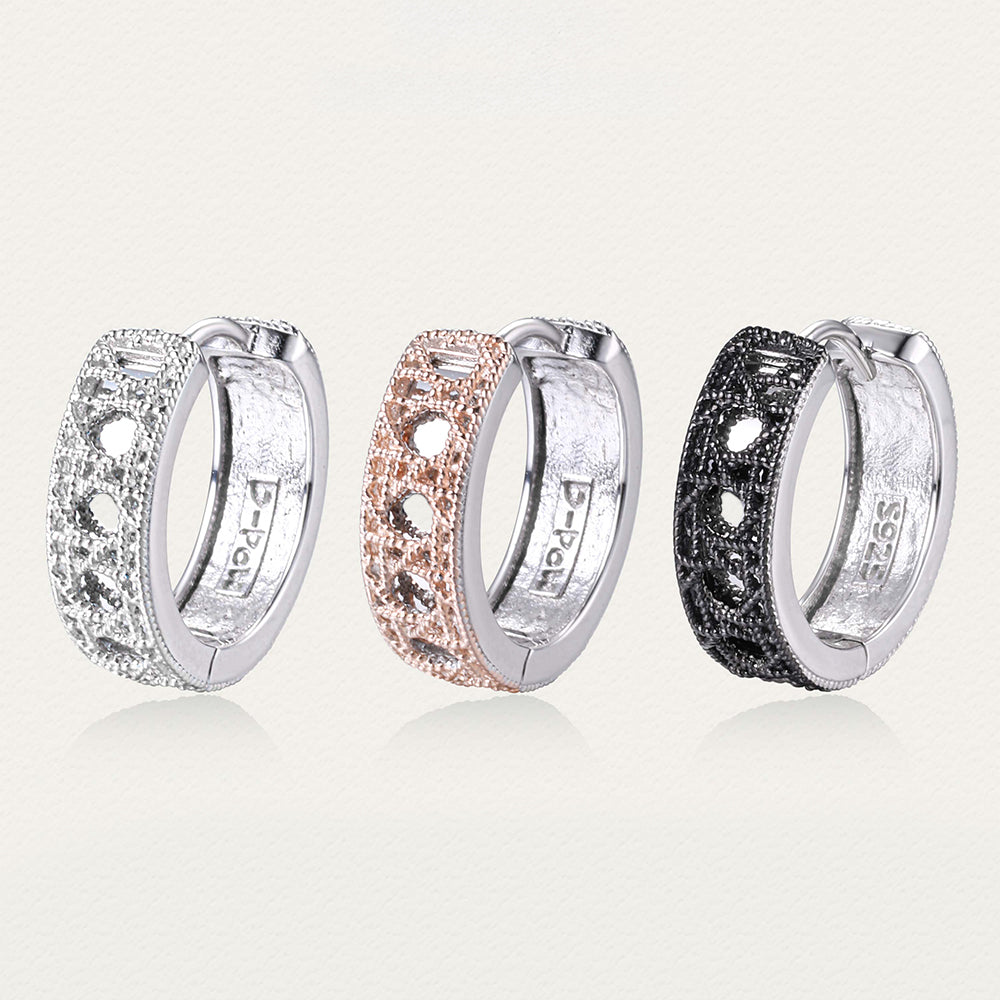 Side-by-side display of Tindall Light ear clips in black, silver, and gold, highlighting color variations and shared craftsmanship.