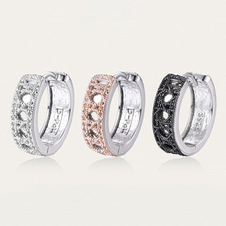 Side-by-side display of Tindall Light ear clips in black, silver, and gold, highlighting color variations and shared craftsmanship.